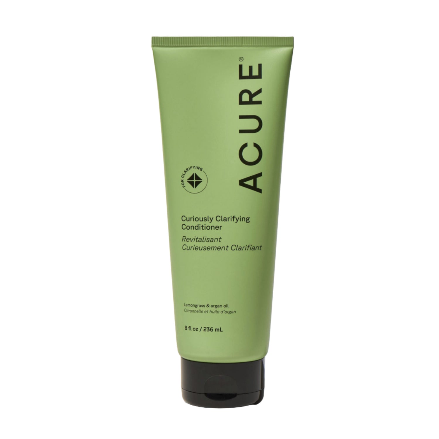 Green tube of Acure Curiously Clarifying Conditioner on a beige background