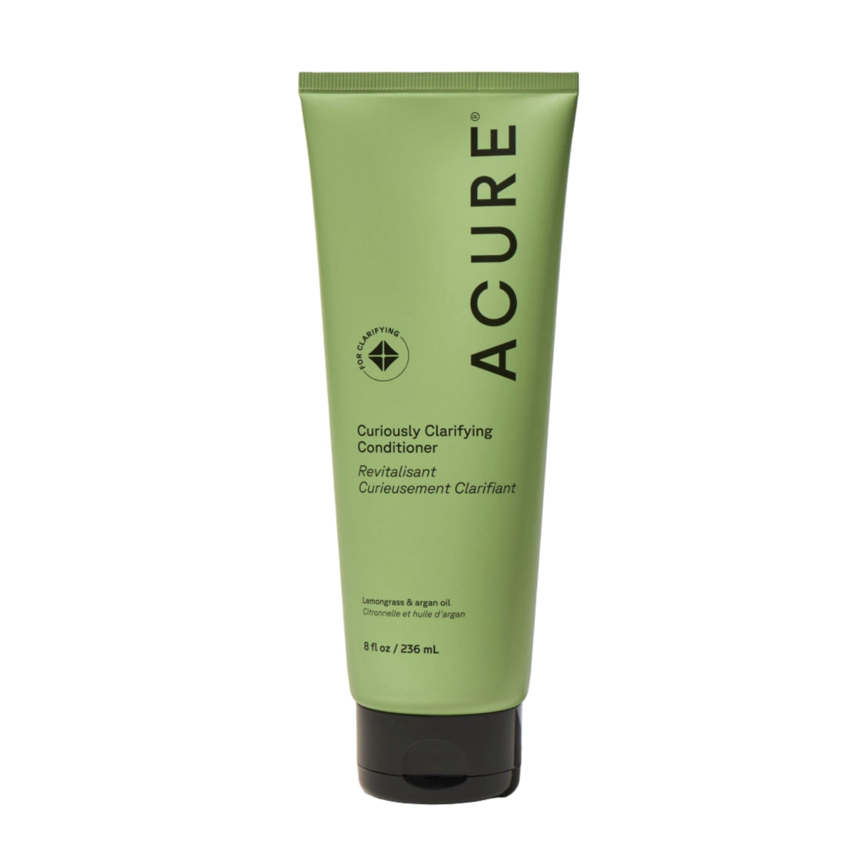 Green tube of Acure Curiously Clarifying Conditioner on a beige background