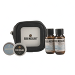 Bush Medjina skincare and grooming products including a black pouch, bottles, and containers on a white background.