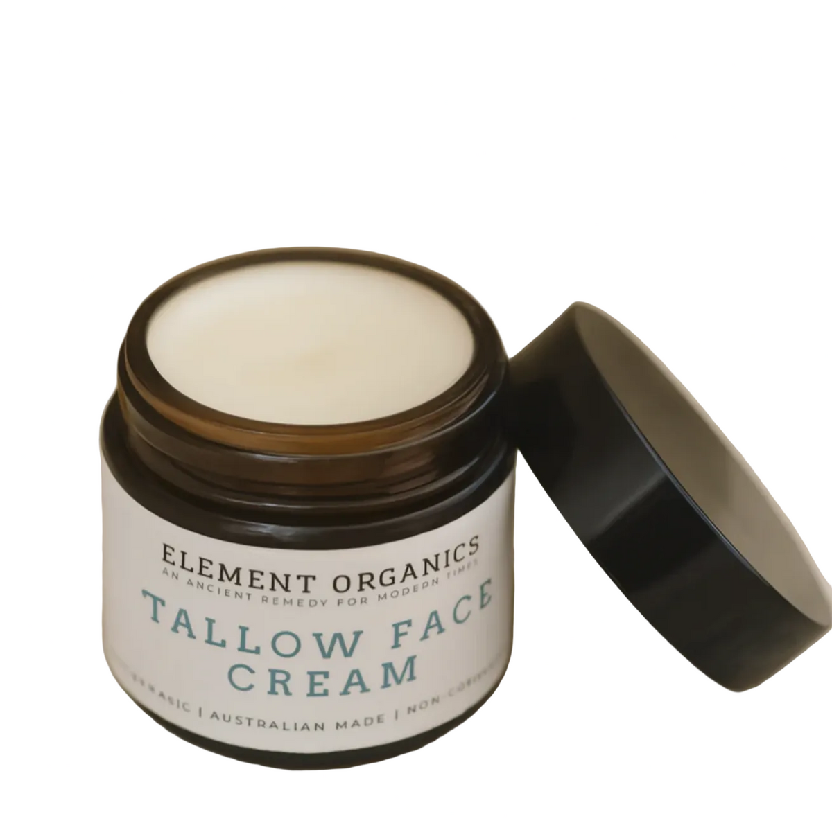 Jar of Element Organics Tallow Face Cream on a textured surface with a neutral background