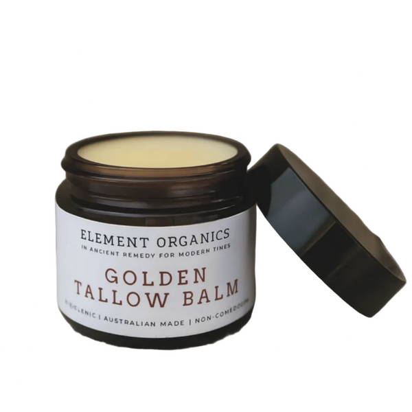 Jar of Golden Tallow Balm from Element Organics on a wooden surface