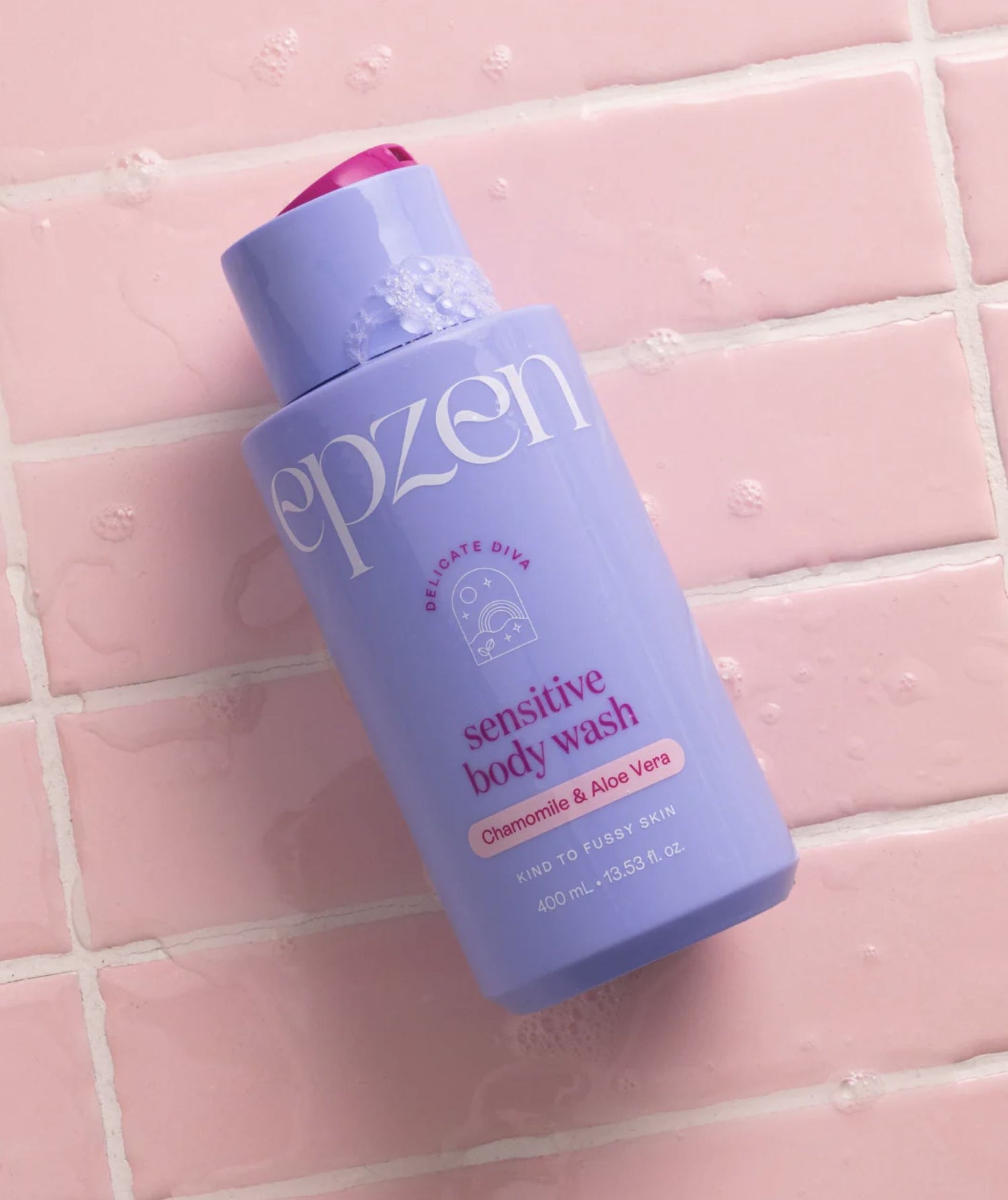 Purple bottle of epzen sensitive body wash on a pink tiled background
