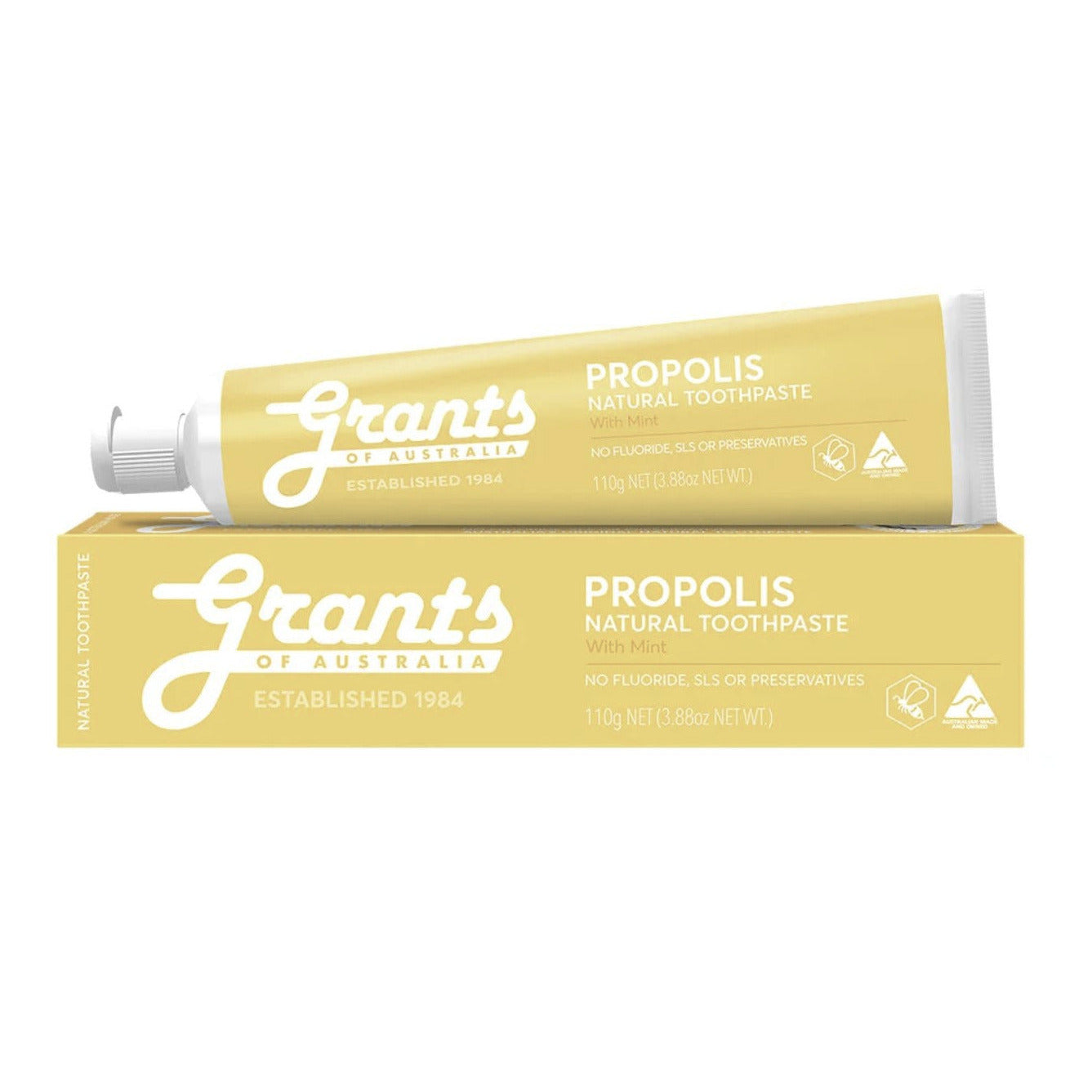 Yellow tube and packaging of Grants Propolis Natural Toothpaste on a white background
