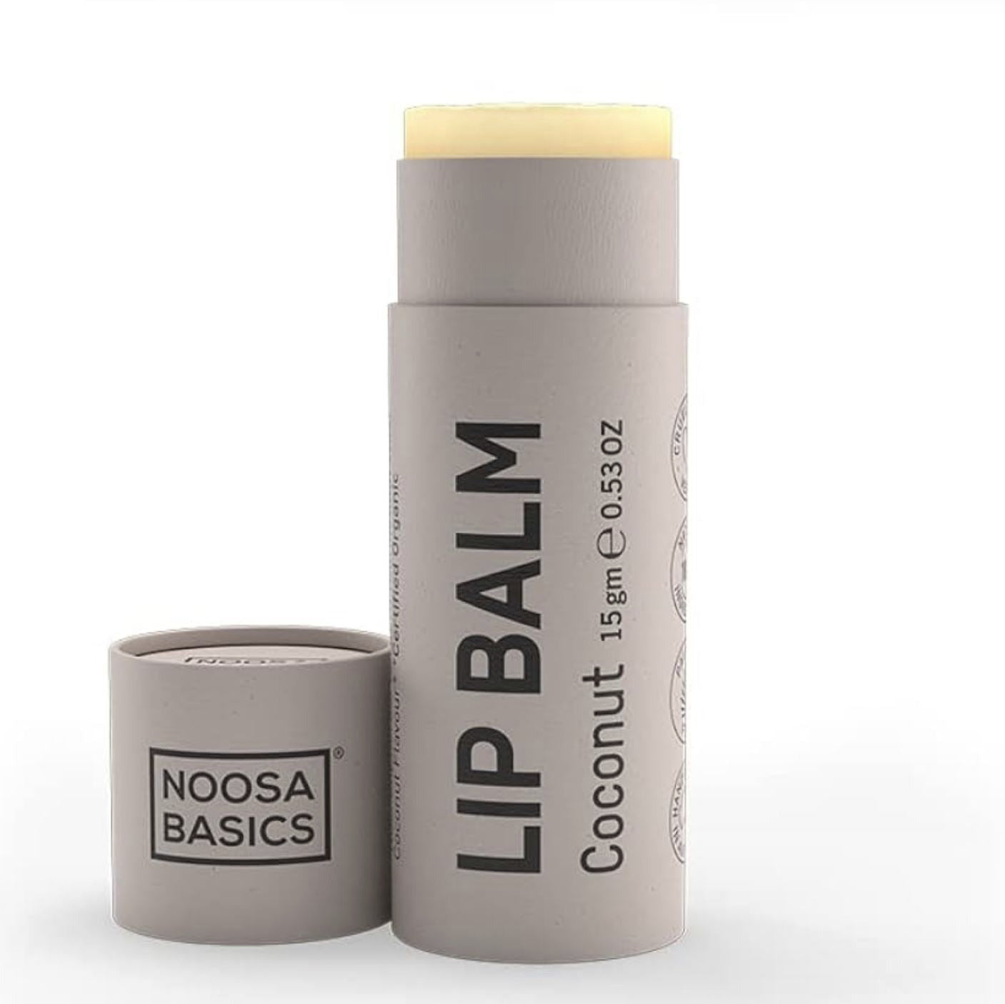 Lip balm stick with container on a white background, featuring 'Noosa Basics' branding.