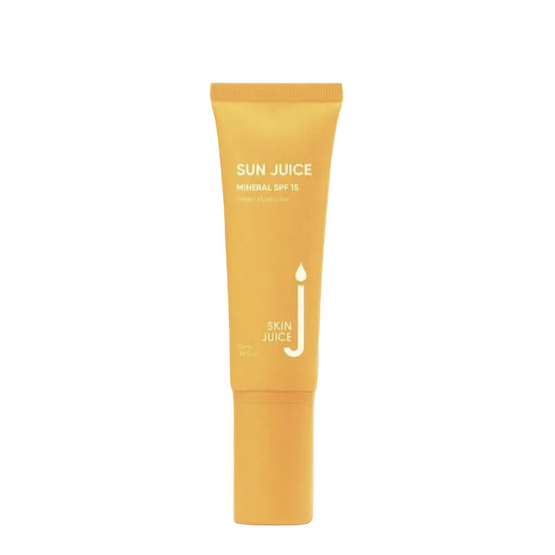 A yellow tube of SKIN JUICE Sun Juice Mineral SPF 15 Tinted sunscreen cream against a beige background.