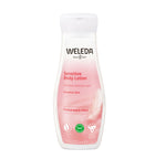 Weleda sensitive body lotion bottle on a white background