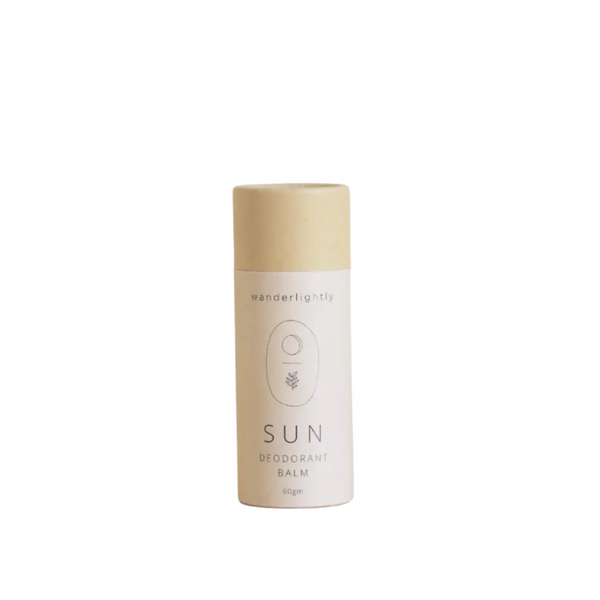 Deodorant balm with 'wanderlightly' branding on a beige background, featuring awards badges.