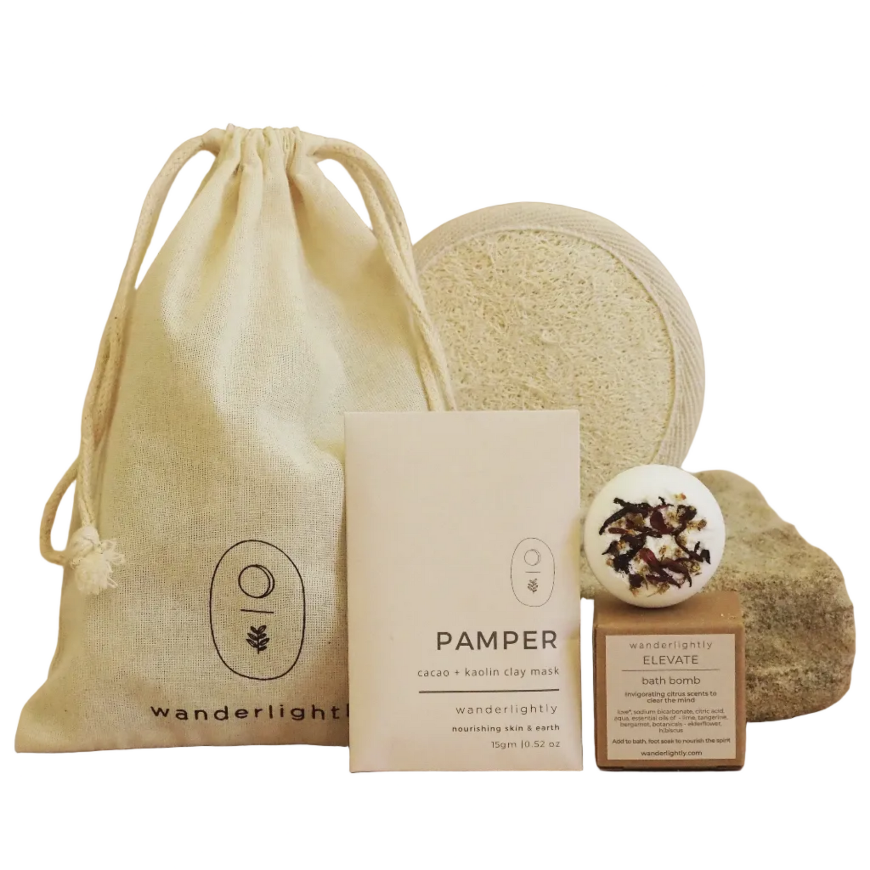 Set of natural skincare products including a drawstring bag, bath bomb, and soap on a beige background